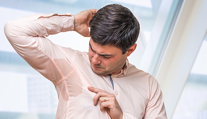 Business Man With Sweating Under Armpit In Office