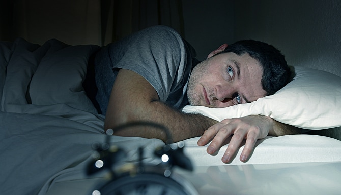 Man In Bed With Eyes Opened Suffering Insomnia And Sleep Disorder