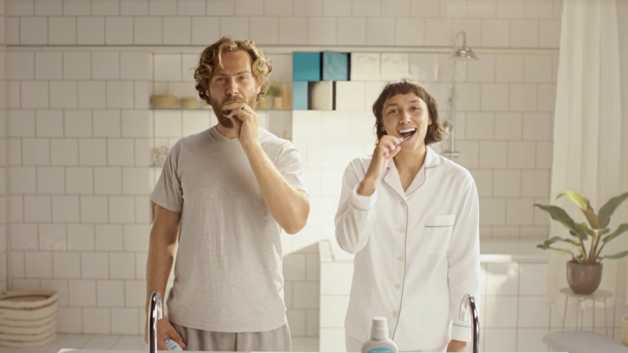 Couple cleaning teeth with Hello toothpaste