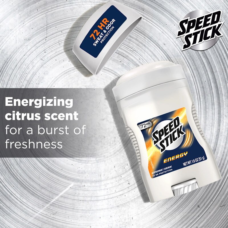 Speed Stick Energy deodorant stick with its cap off, laying on a silver metallic background. Text reads, "Energizing citrus scent for a burst of freshness," highlighting the fragrance.