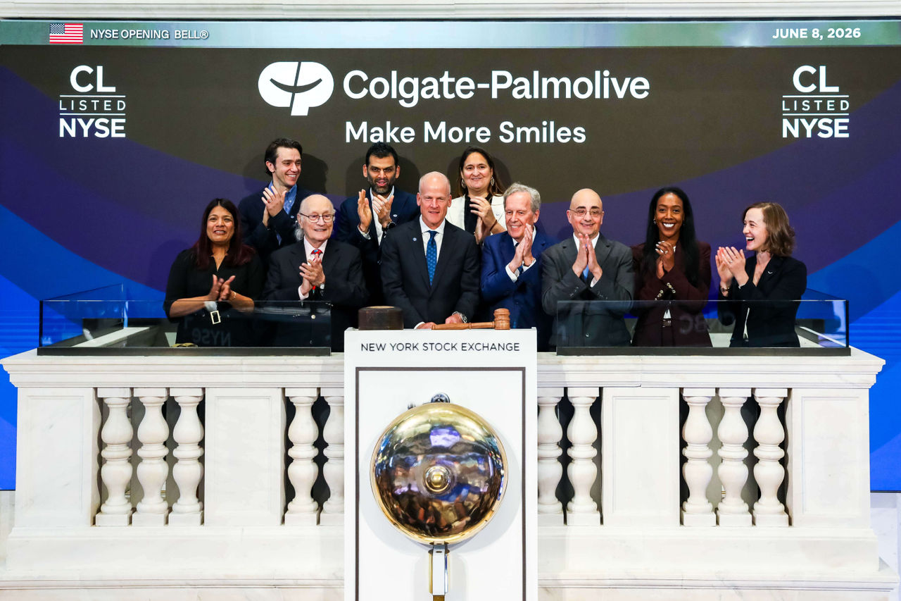 CEO Noel Wallace and executives ring the New York Stock Exchange opening bell for Colgate.