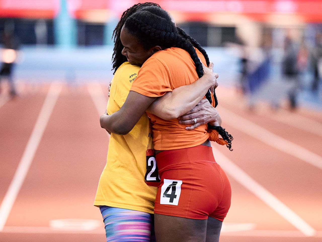 two girls hugging each other after competing