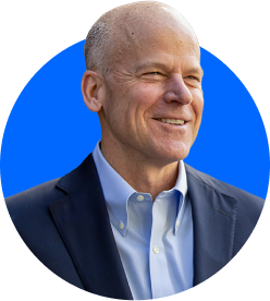 Picture of Noel Wallace on a blue background.