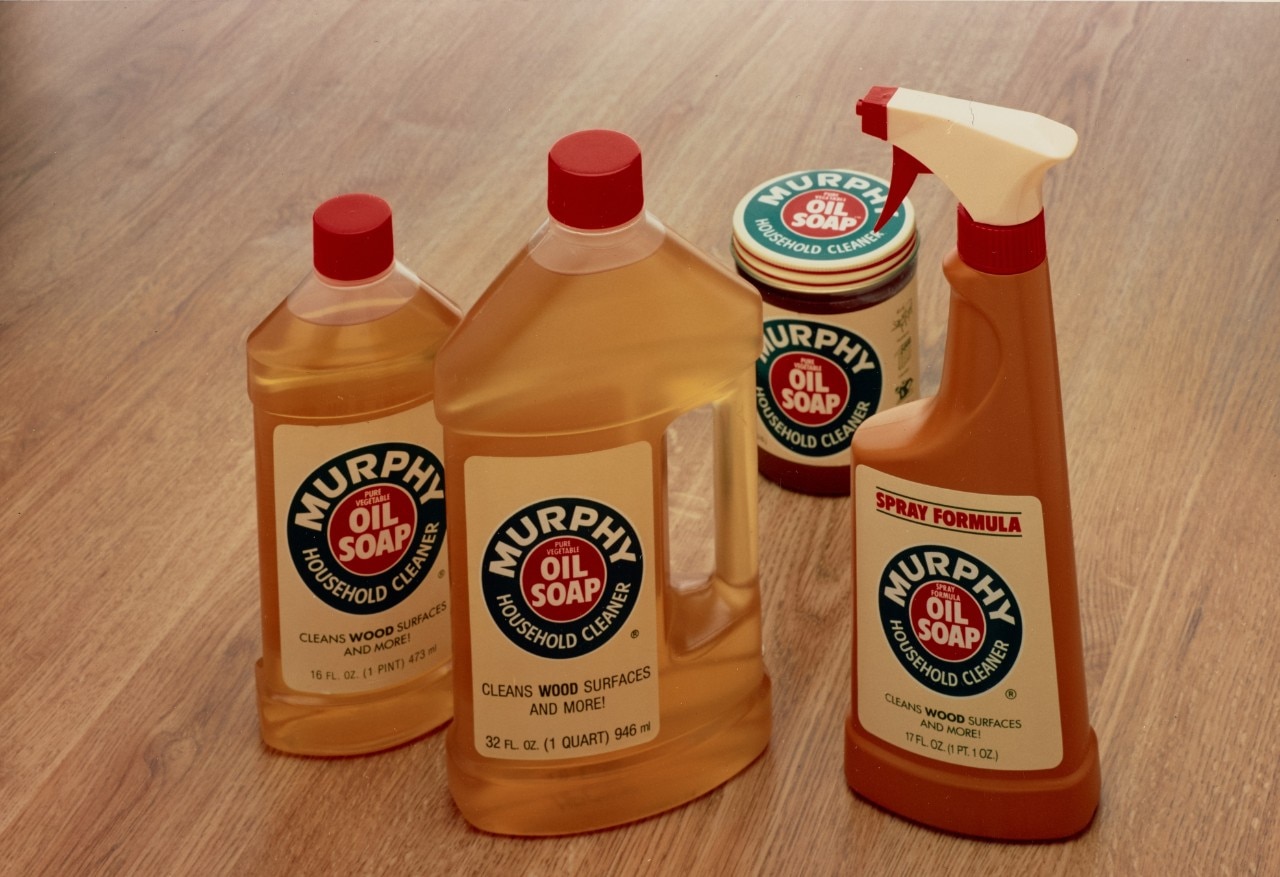 Image shows bottles and container of Murphy Oil Soap, a cleaning product, with two bottles, one spray bottle, and a small can.