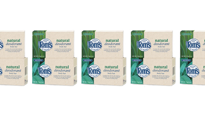 Five boxes of Toms Natural Deodorant, each featuring blue and green packaging, arranged in a row.